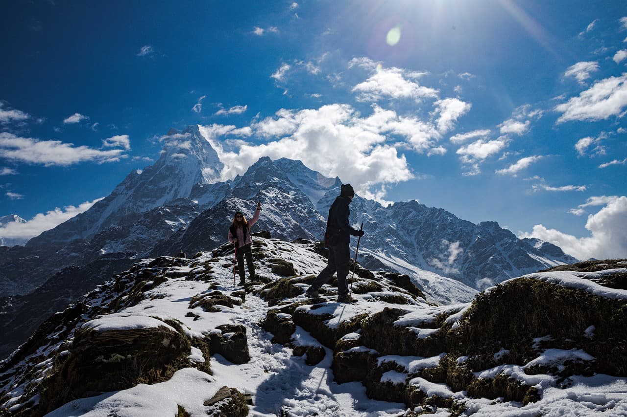 Group of Trekkers Celebrating the Journey with Stunning Himalayan Views on the Mardi Himal Trek